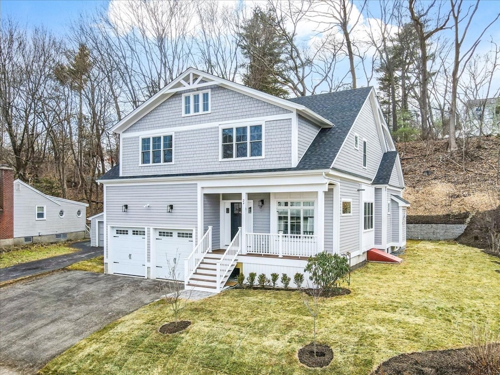 24 Jayne Road Needham, MA 02494 - Photo 2 of 34 a view of a white house with large windows and a yard with big trees