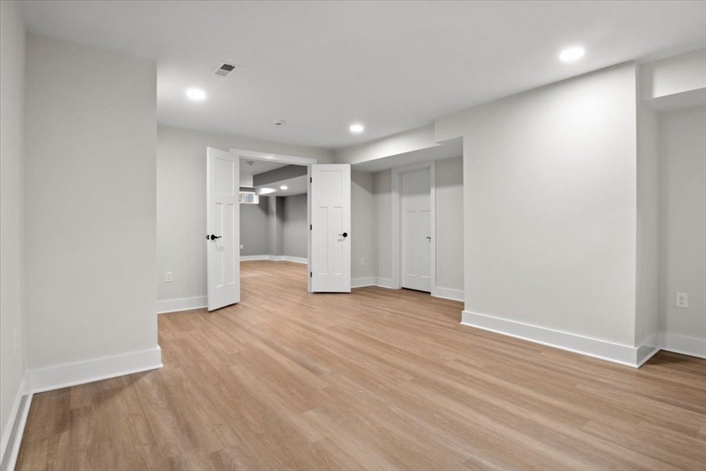 24 Jayne Road Needham, MA 02494 - Photo 28 of 34 a view of empty room with wooden floor