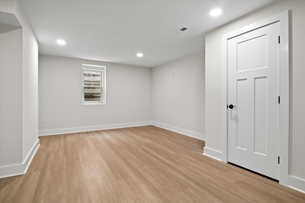 24 Jayne Road Needham, MA 02494 - Photo 30 of 34 wooden floor in an empty room with a window