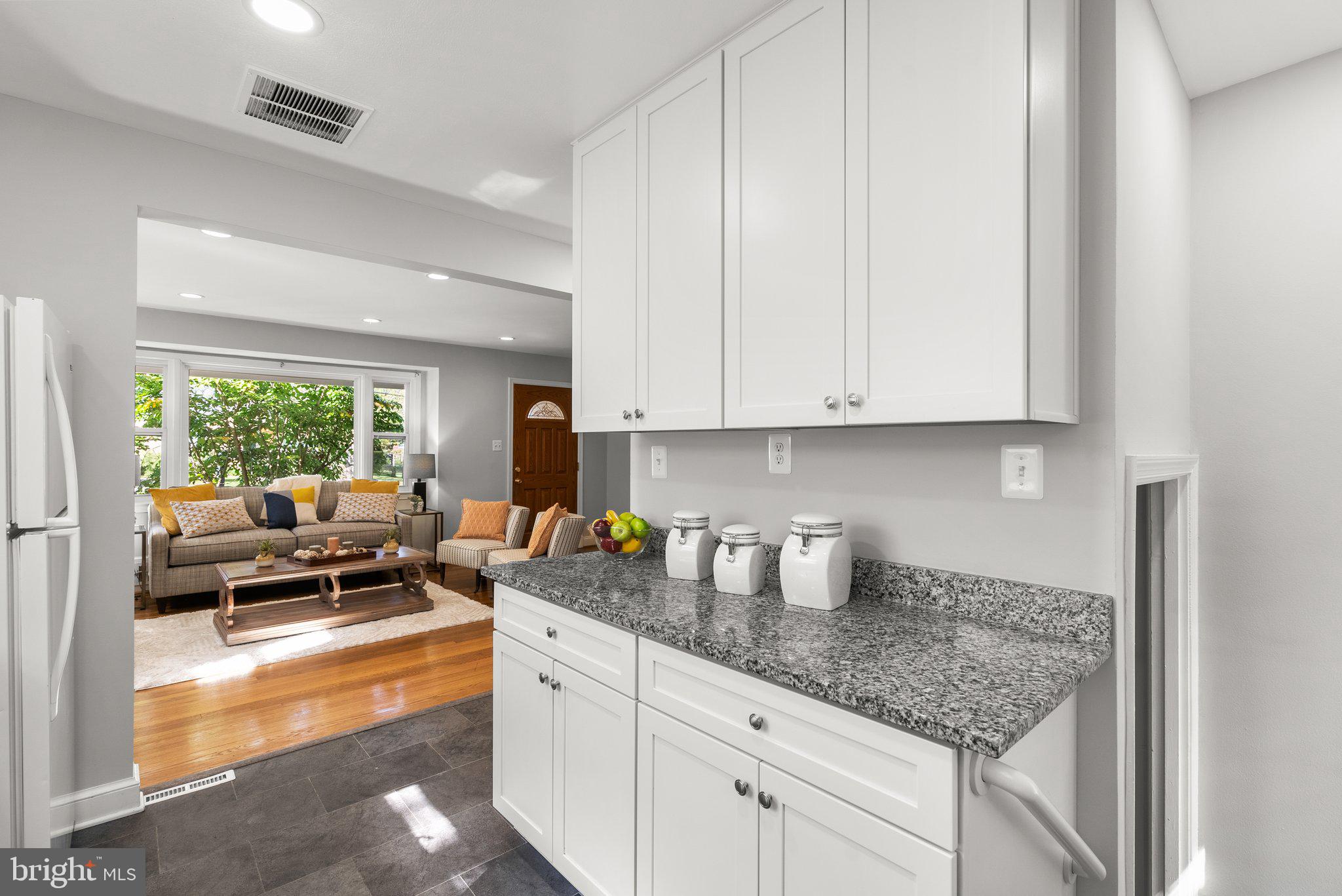 2206 Darrow Street Silver Spring, MD 20902 - Photo 11 of 31 a kitchen with appliances a counter space and a window