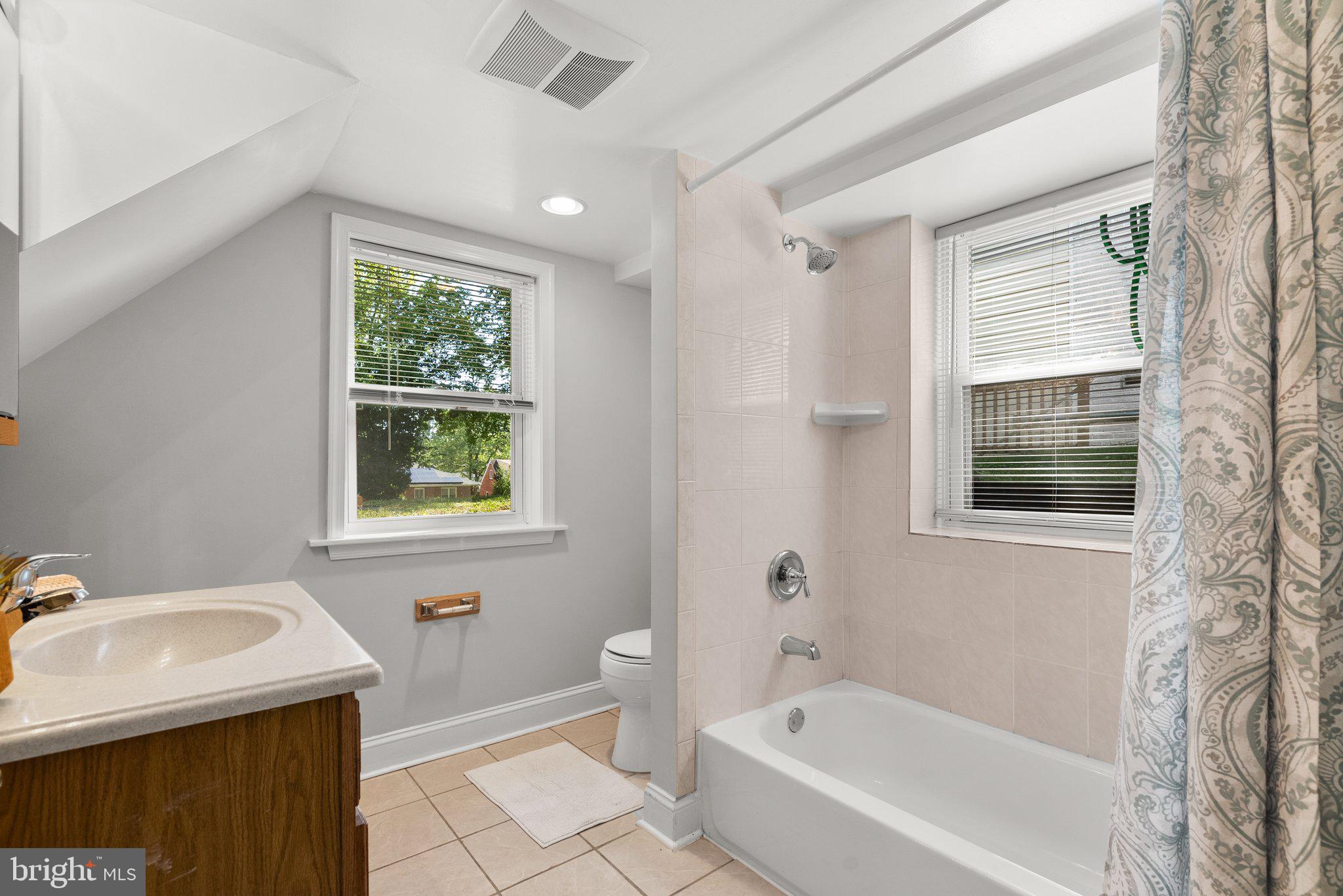 2206 Darrow Street Silver Spring, MD 20902 - Photo 20 of 31 a bathroom with a sink toilet and bathtub