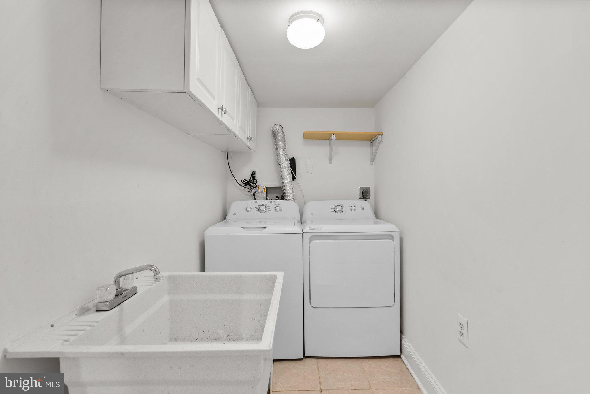 2206 Darrow Street Silver Spring, MD 20902 - Photo 21 of 31 a utility room with dryer and washer