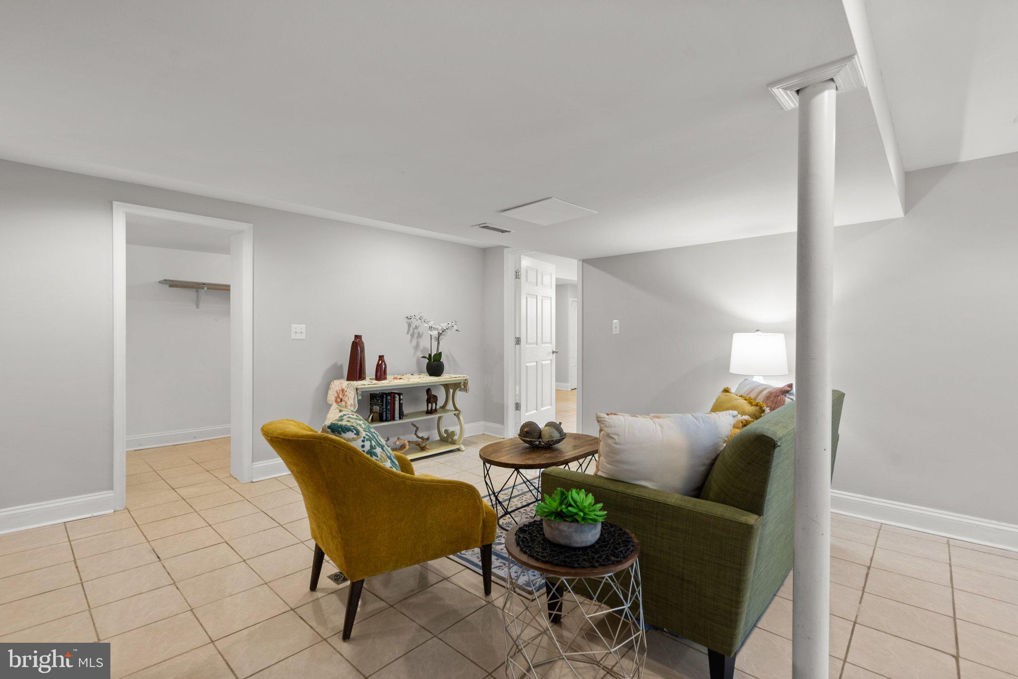 2206 Darrow Street Silver Spring, MD 20902 - Photo 23 of 31 a living room with furniture and a chandelier