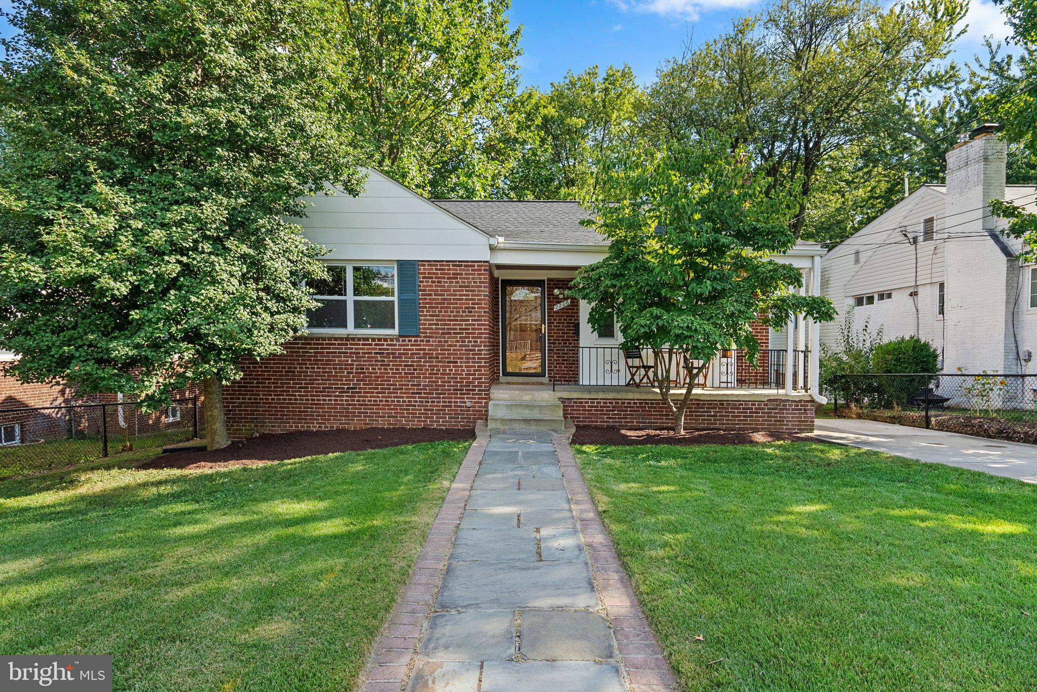 2206 Darrow Street Silver Spring, MD 20902 - Photo 30 of 31 a front view of a house with a yard and trees