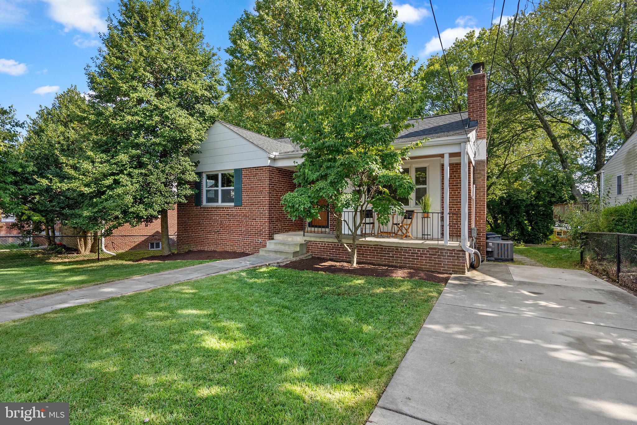 2206 Darrow Street Silver Spring, MD 20902 - Photo 31 of 31 a view of a house with a yard and sitting area