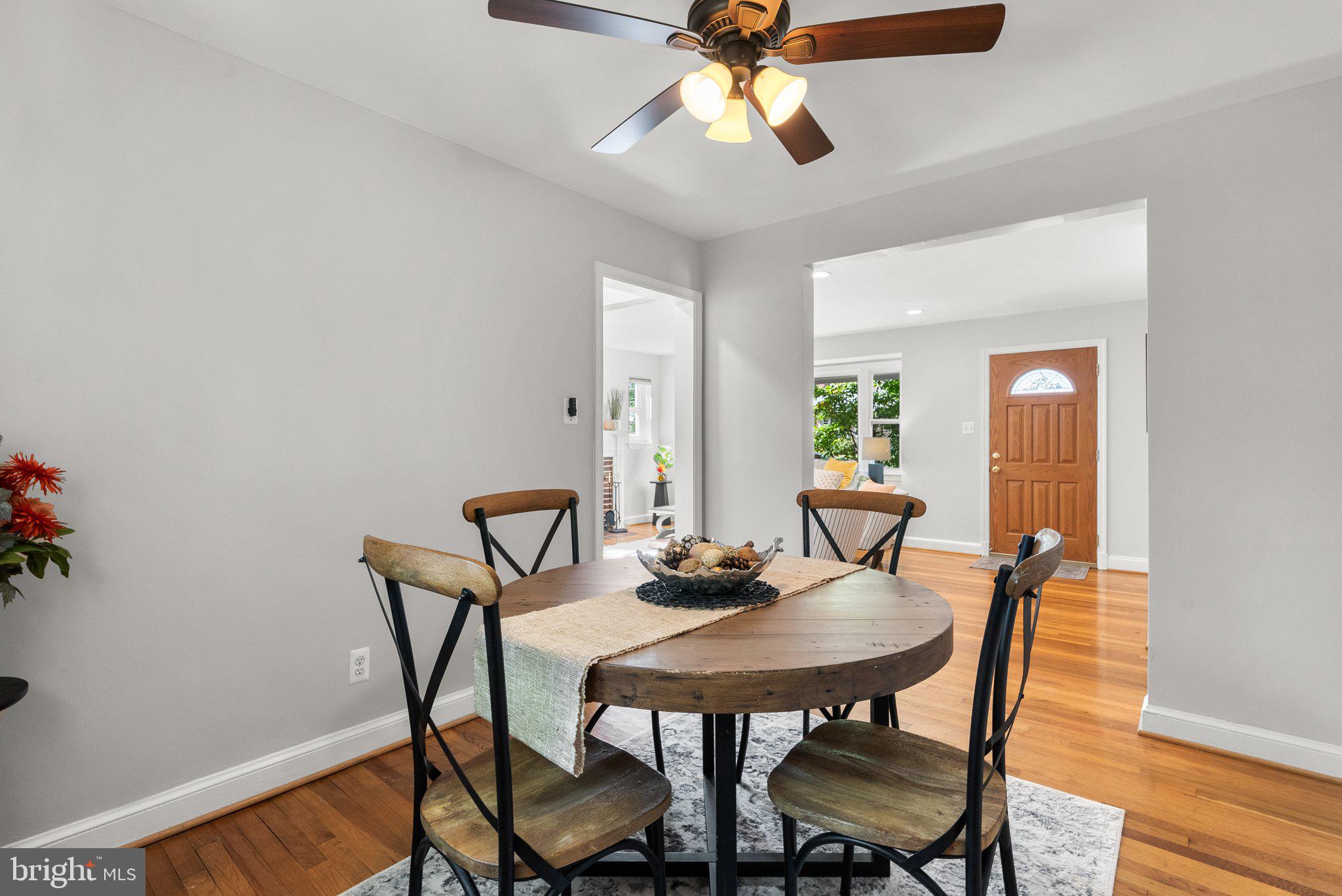 2206 Darrow Street Silver Spring, MD 20902 - Photo 8 of 31 a view of a dining room with furniture and wooden floor