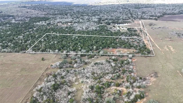 an aerial view of house with yard
