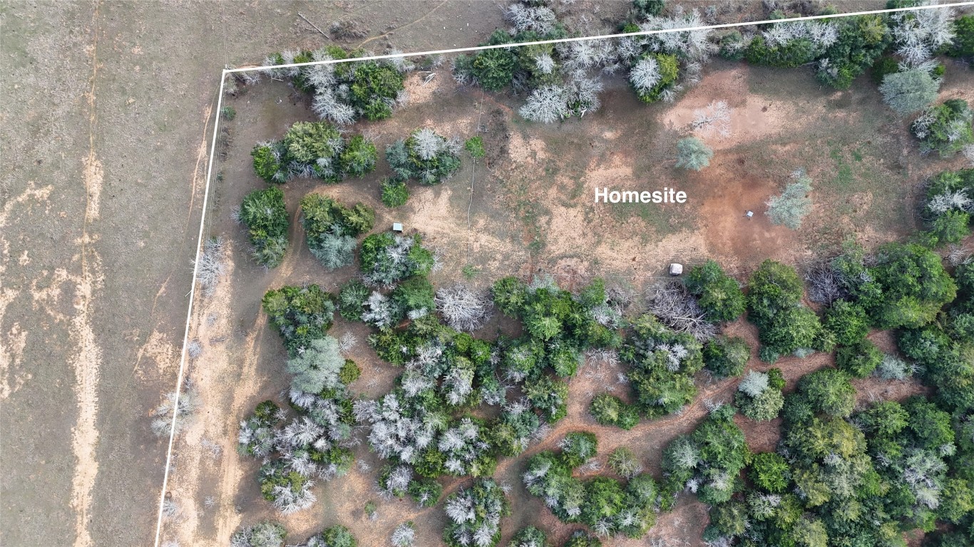 259 Meduna Road Smithville, TX 78957 - Photo 8 of 12 a backyard of a house with a yard and outdoor seating