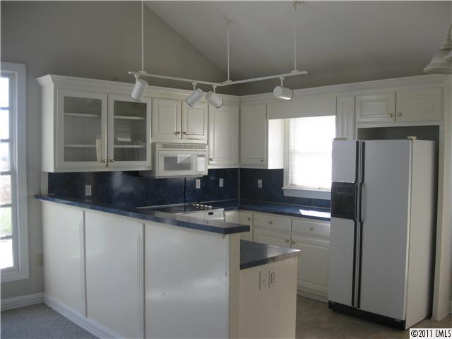 2012 Haigler Baucom Road Monroe, NC 28110 - Photo 4 of 11 a kitchen with stainless steel appliances granite countertop a sink and refrigerator