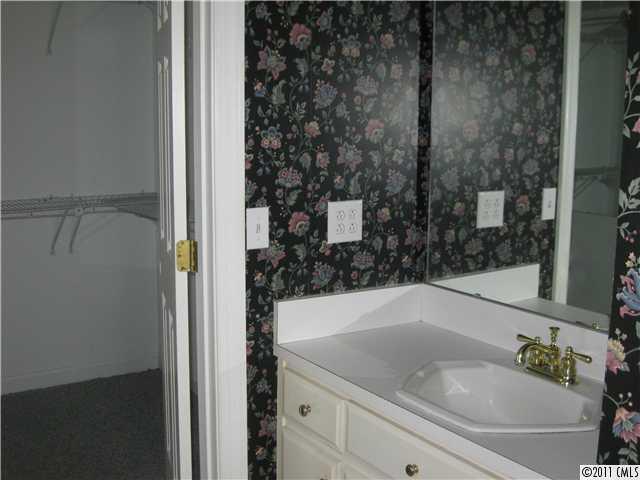 2012 Haigler Baucom Road Monroe, NC 28110 - Photo 7 of 11 a bathroom with a granite countertop sink and a mirror