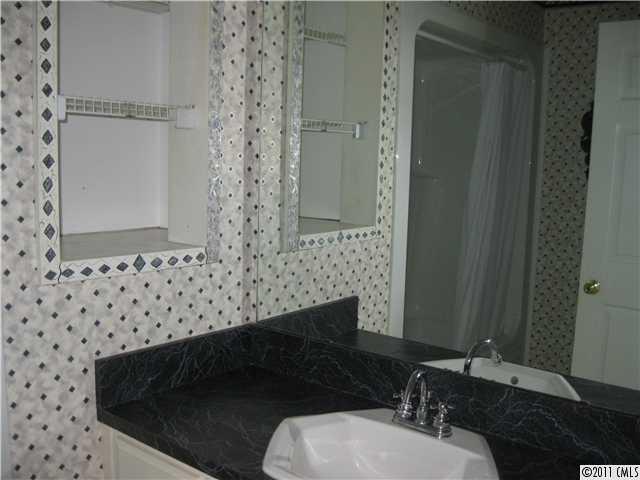2012 Haigler Baucom Road Monroe, NC 28110 - Photo 9 of 11 a bathroom with a toilet a sink and a mirror