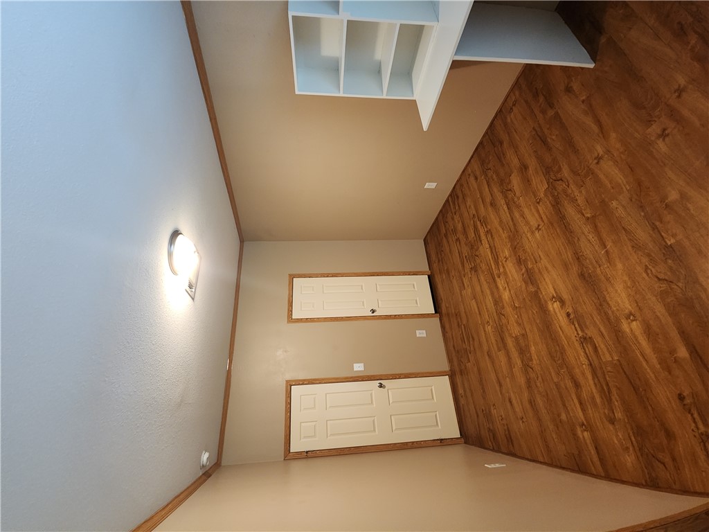 3738 Smetana Road Bryan, TX 77807 - Photo 23 of 29 an empty room with wooden floor and closet