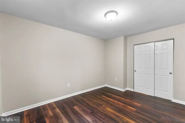 a view of room with wooden floor