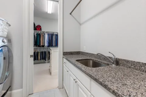 a kitchen with a sink and a refrigerator