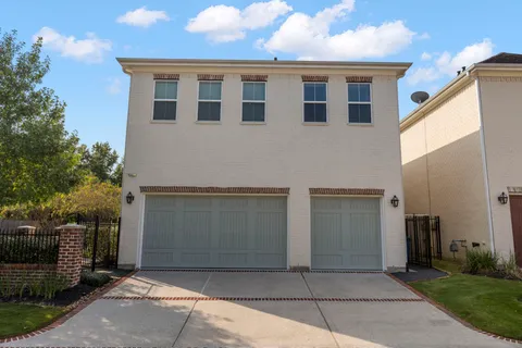 a front view of a house with parking space