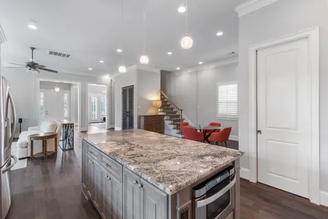 a kitchen with a table and chairs