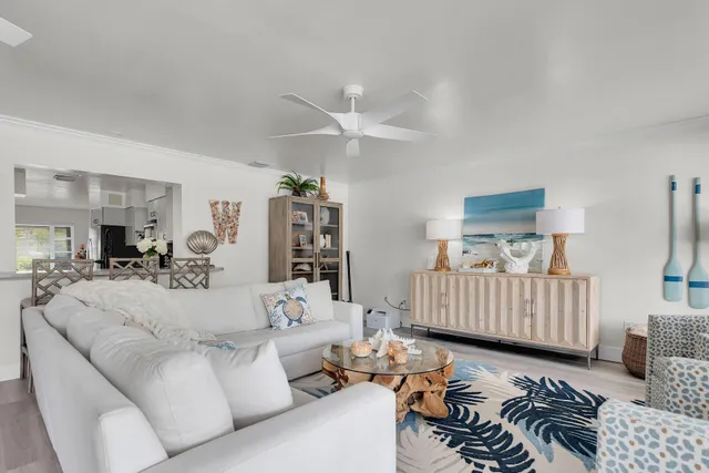 a kitchen with a sink white cabinets and counter space