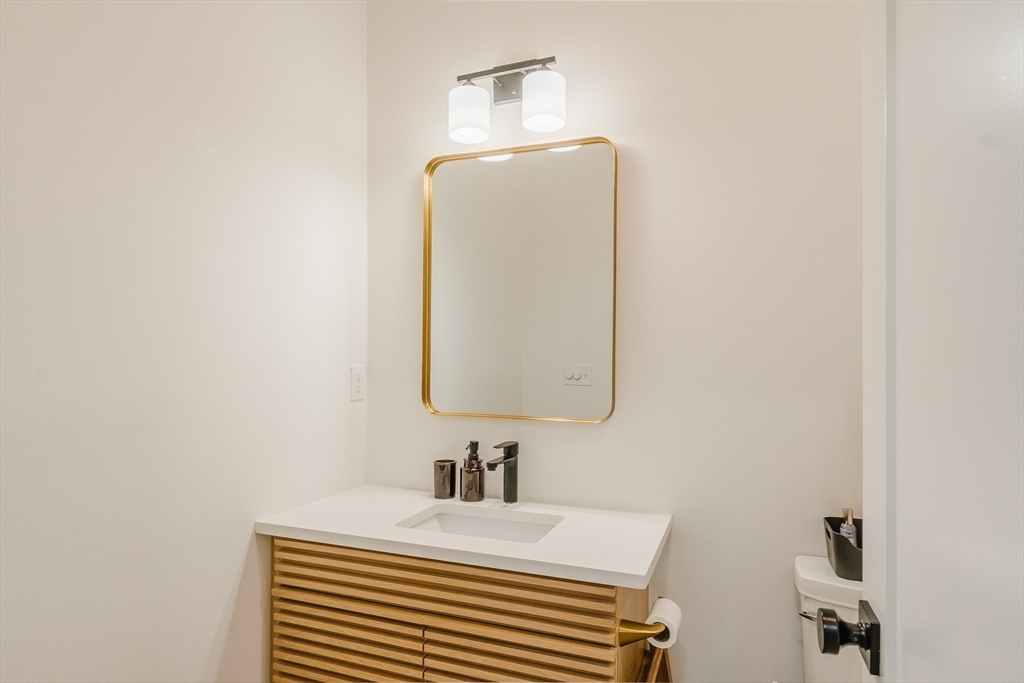 43 Withington Street, Unit 7 Boston, MA 02124 - Photo 12 of 21 a bathroom with a sink and a mirror