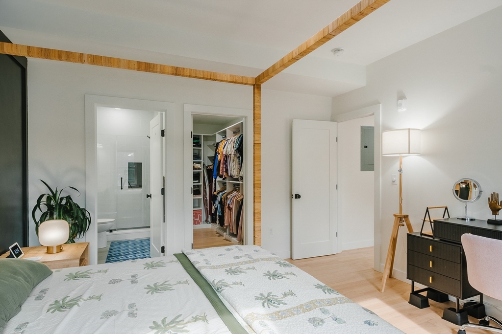 43 Withington Street, Unit 7 Boston, MA 02124 - Photo 15 of 21 a bedroom with a bed and a large mirror on the dresser