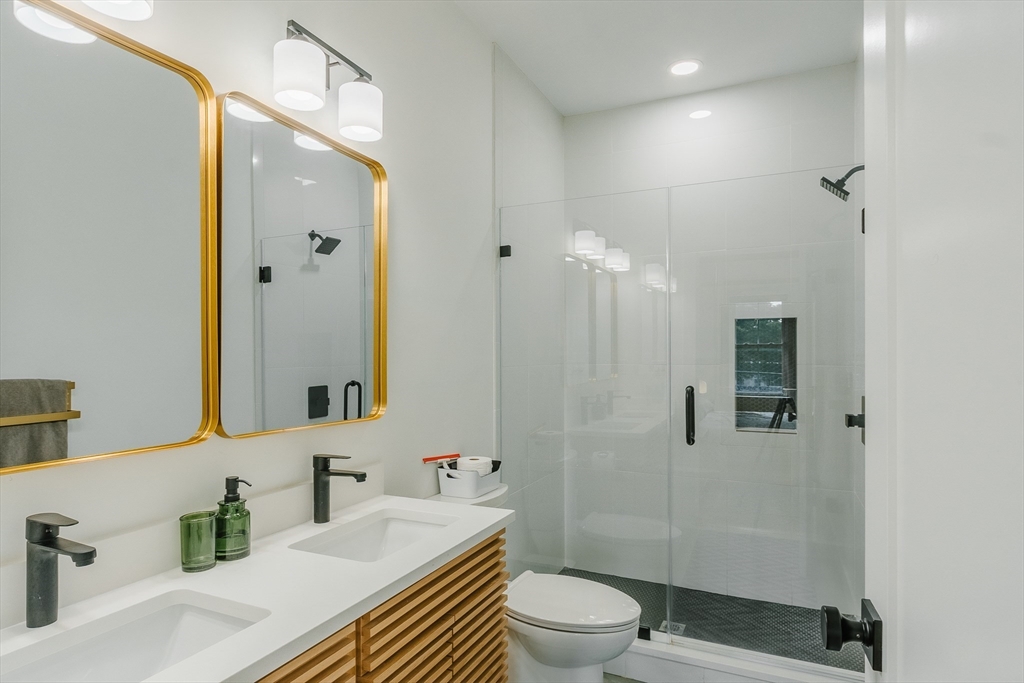 43 Withington Street, Unit 7 Boston, MA 02124 - Photo 17 of 21 a bathroom with a sink a toilet and shower
