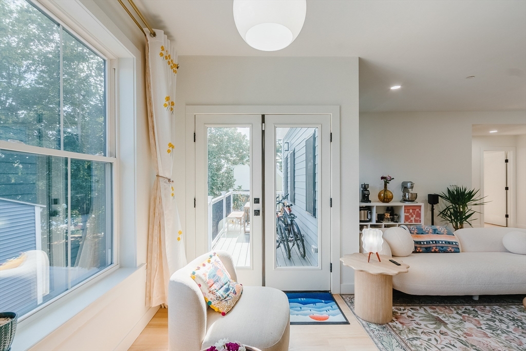 43 Withington Street, Unit 7 Boston, MA 02124 - Photo 7 of 21 a living room with furniture and a large window