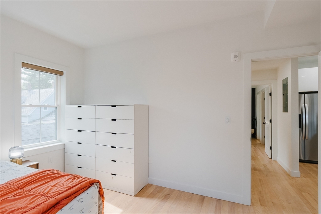 43 Withington Street, Unit 7 Boston, MA 02124 - Photo 8 of 21 a bedroom with a bed and a window