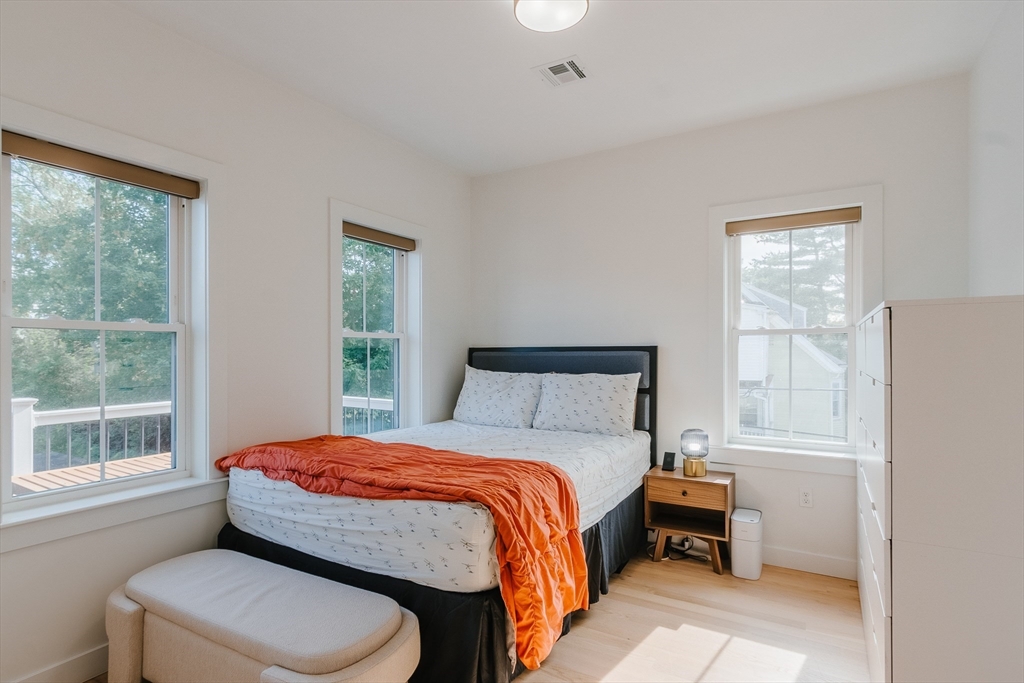 43 Withington Street, Unit 7 Boston, MA 02124 - Photo 9 of 21 a bedroom with a bed and a window