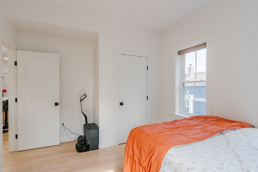 43 Withington Street, Unit 7 Boston, MA 02124 - Photo 10 of 21 a bedroom with a bed and a window