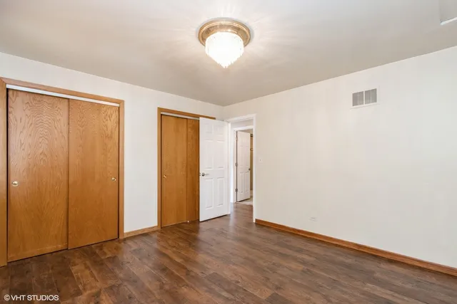 a view of room with wooden floor