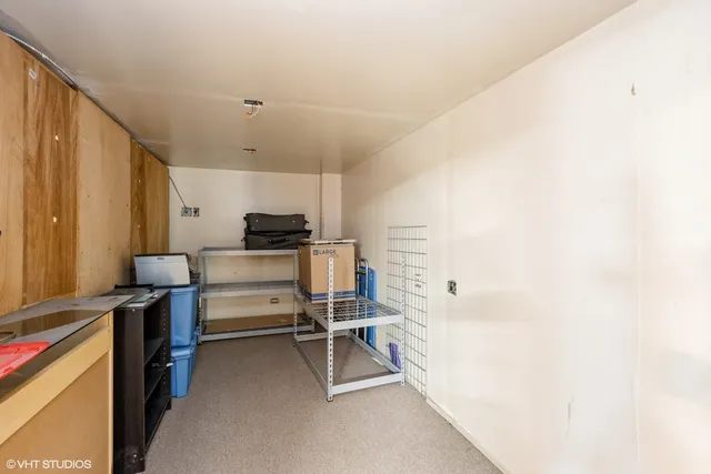 a bathroom with a sink toilet and a mirror