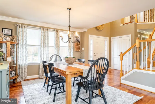 a living room with furniture fireplace and a large window