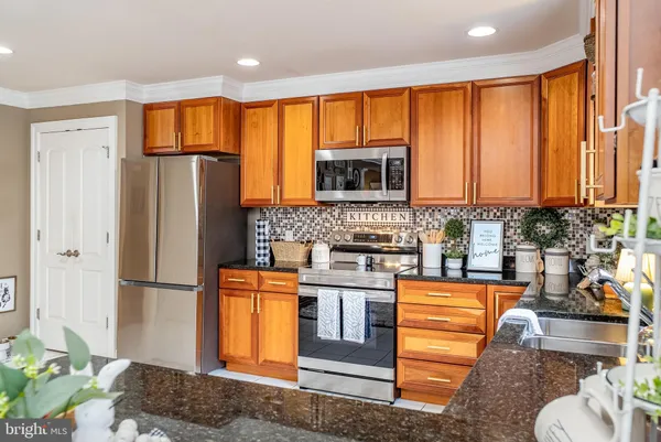 a kitchen with a sink and a white cabinets