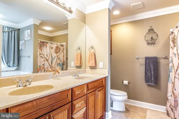 a utility room with a refrigerator and washer
