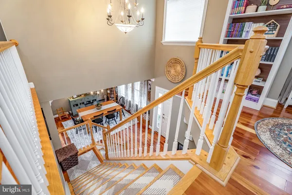 a workspace with chandelier fan and a window