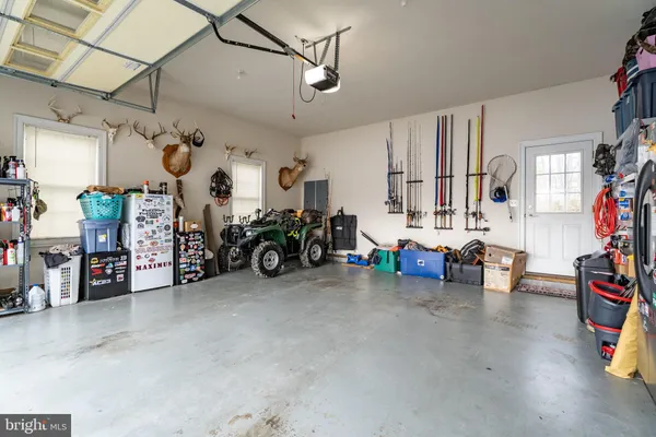 a view of a garage with rack and bicycle