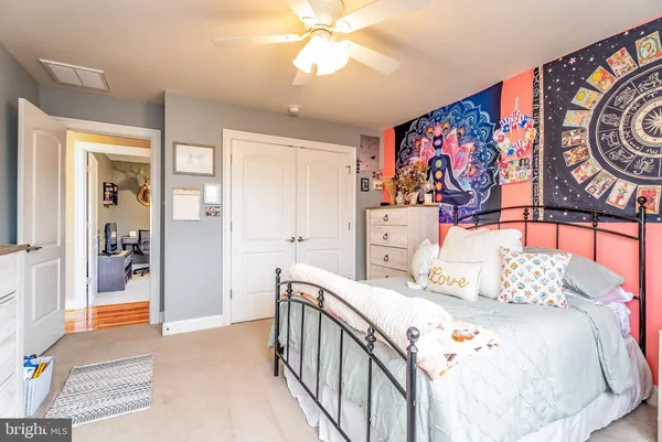 a bathroom with double vanity sinks a mirror and a shower