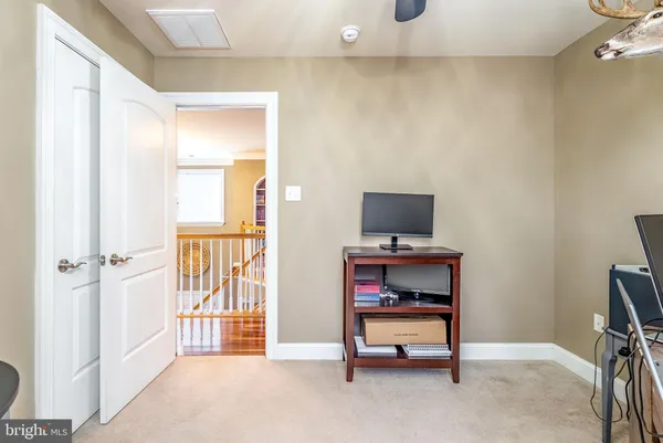 a view of a house with a yard and fence