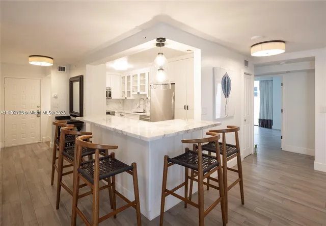 a kitchen with a table and chairs in it