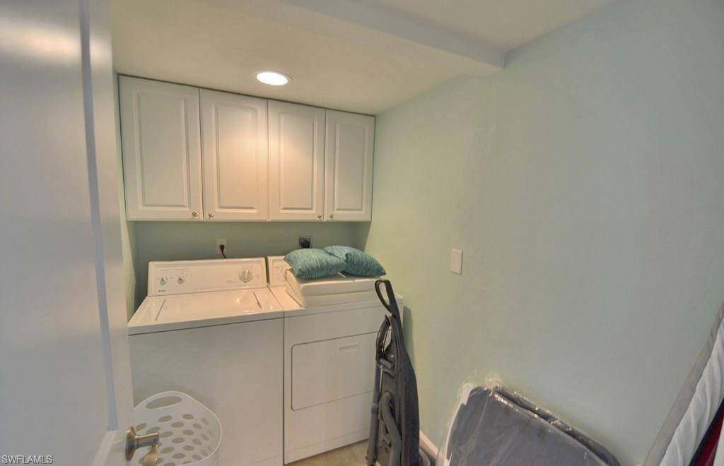 307 Goodlette-Frank Road, Unit 506B Naples, FL 34102 - Photo 19 of 25 a utility room with dryer and washer