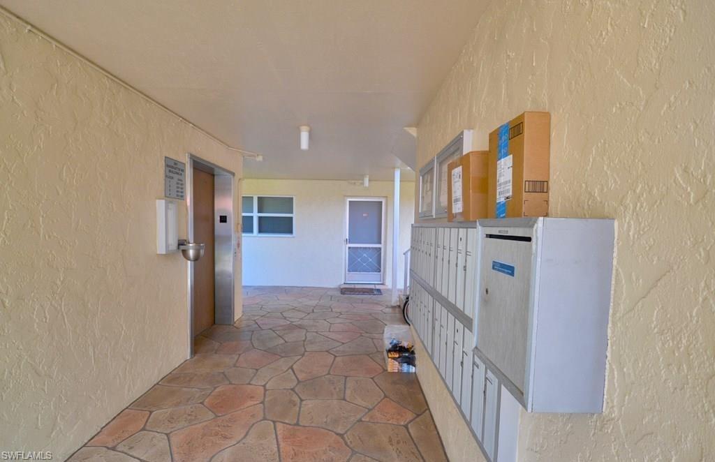307 Goodlette-Frank Road, Unit 506B Naples, FL 34102 - Photo 20 of 25 a view of hallway with stairs