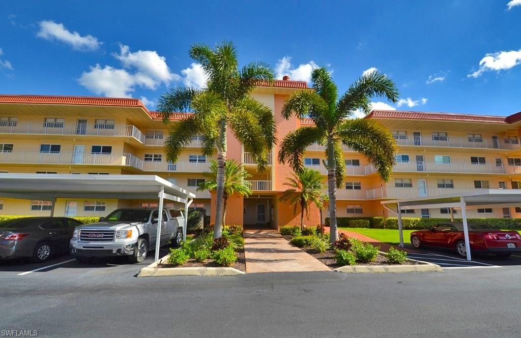 307 Goodlette-Frank Road, Unit 506B Naples, FL 34102 - Photo 2 of 25 a front view of a building with street