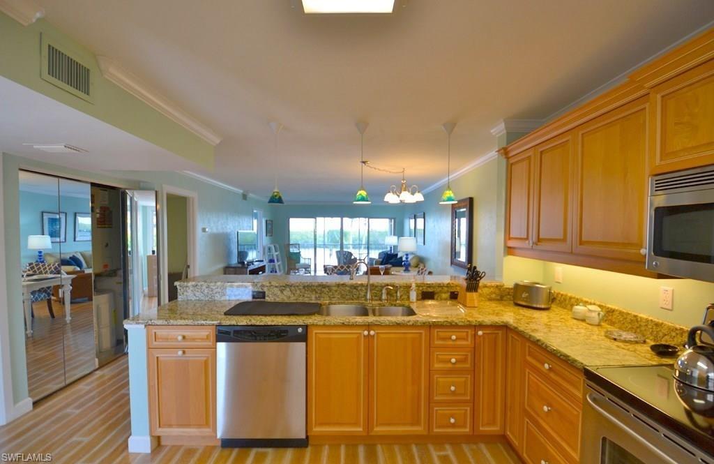 307 Goodlette-Frank Road, Unit 506B Naples, FL 34102 - Photo 9 of 25 a kitchen with counter top space and appliances