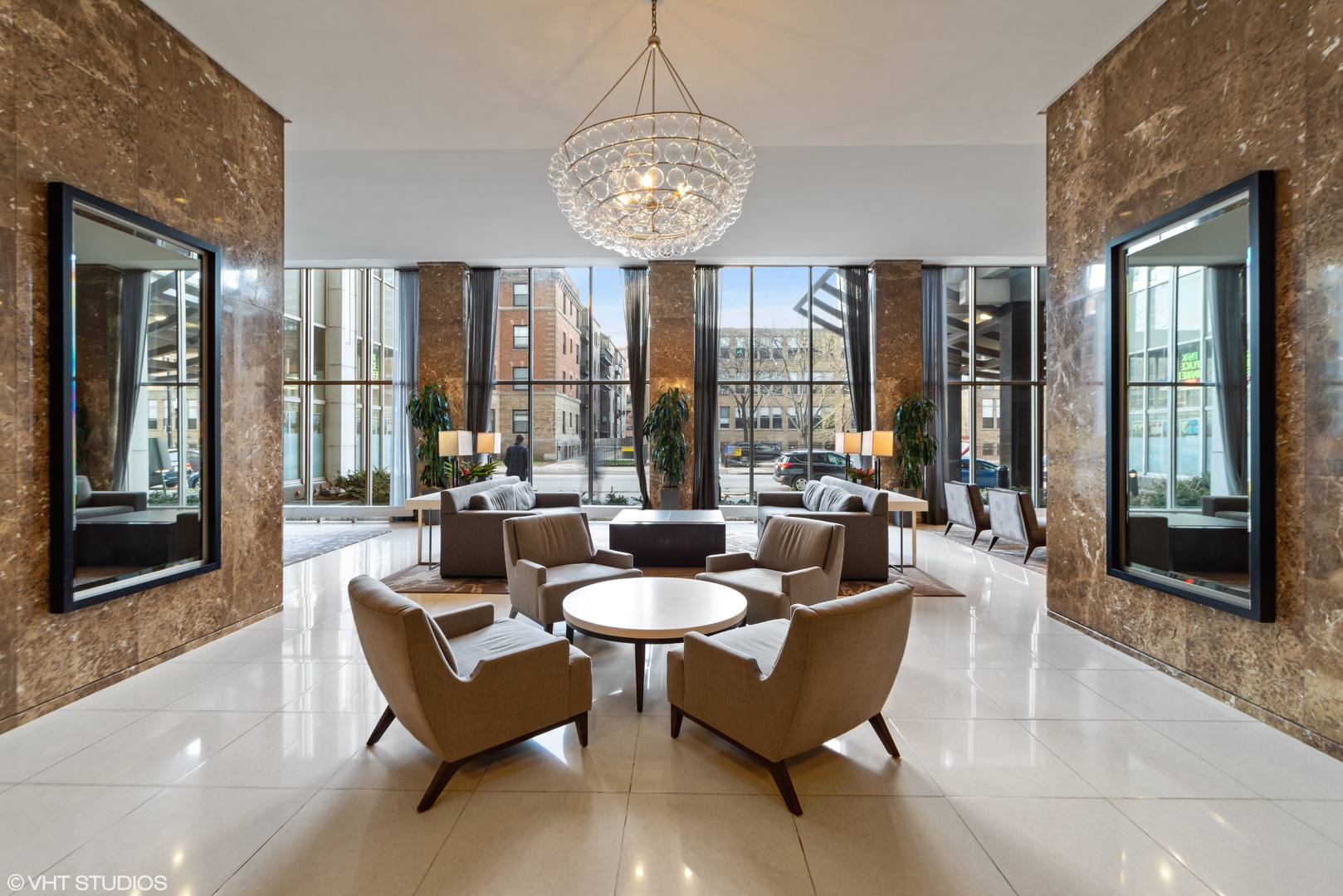 655 West Irving Park Road, Unit 4915 Chicago, IL 60613 - Photo 13 of 17 a dining room with furniture and large windows
