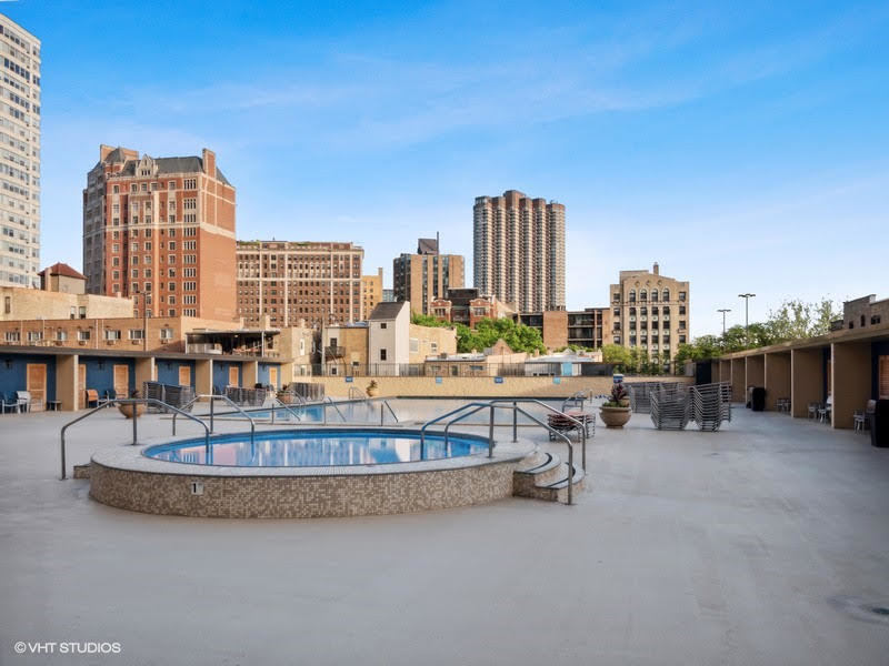 655 West Irving Park Road, Unit 4915 Chicago, IL 60613 - Photo 17 of 17 a view of balcony with outdoor seating space and city view