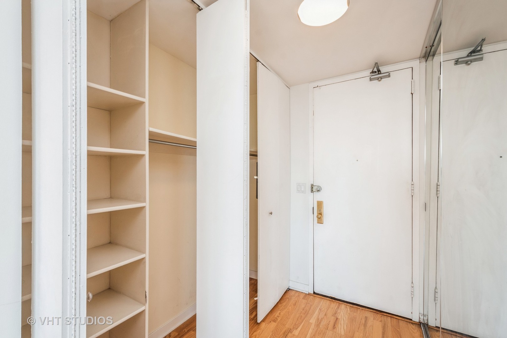 655 West Irving Park Road, Unit 4915 Chicago, IL 60613 - Photo 2 of 17 a view of walk in closet with empty racks