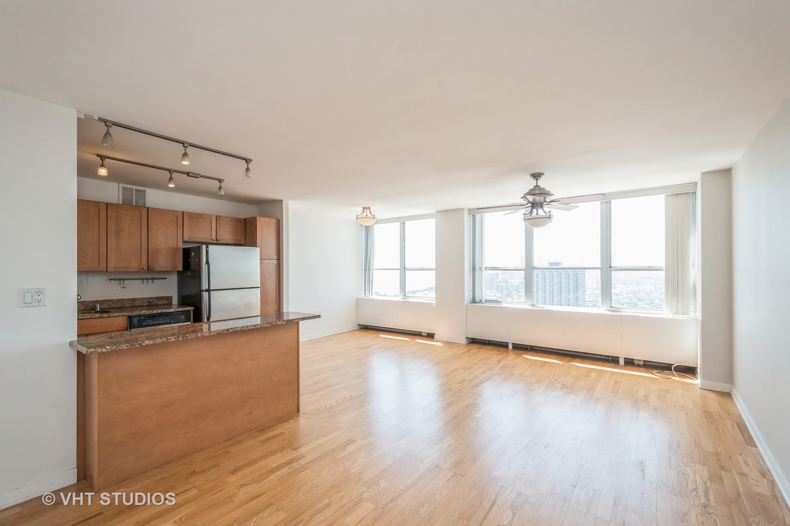 655 West Irving Park Road, Unit 4915 Chicago, IL 60613 - Photo 3 of 17 a view of a kitchen with a sink and a window