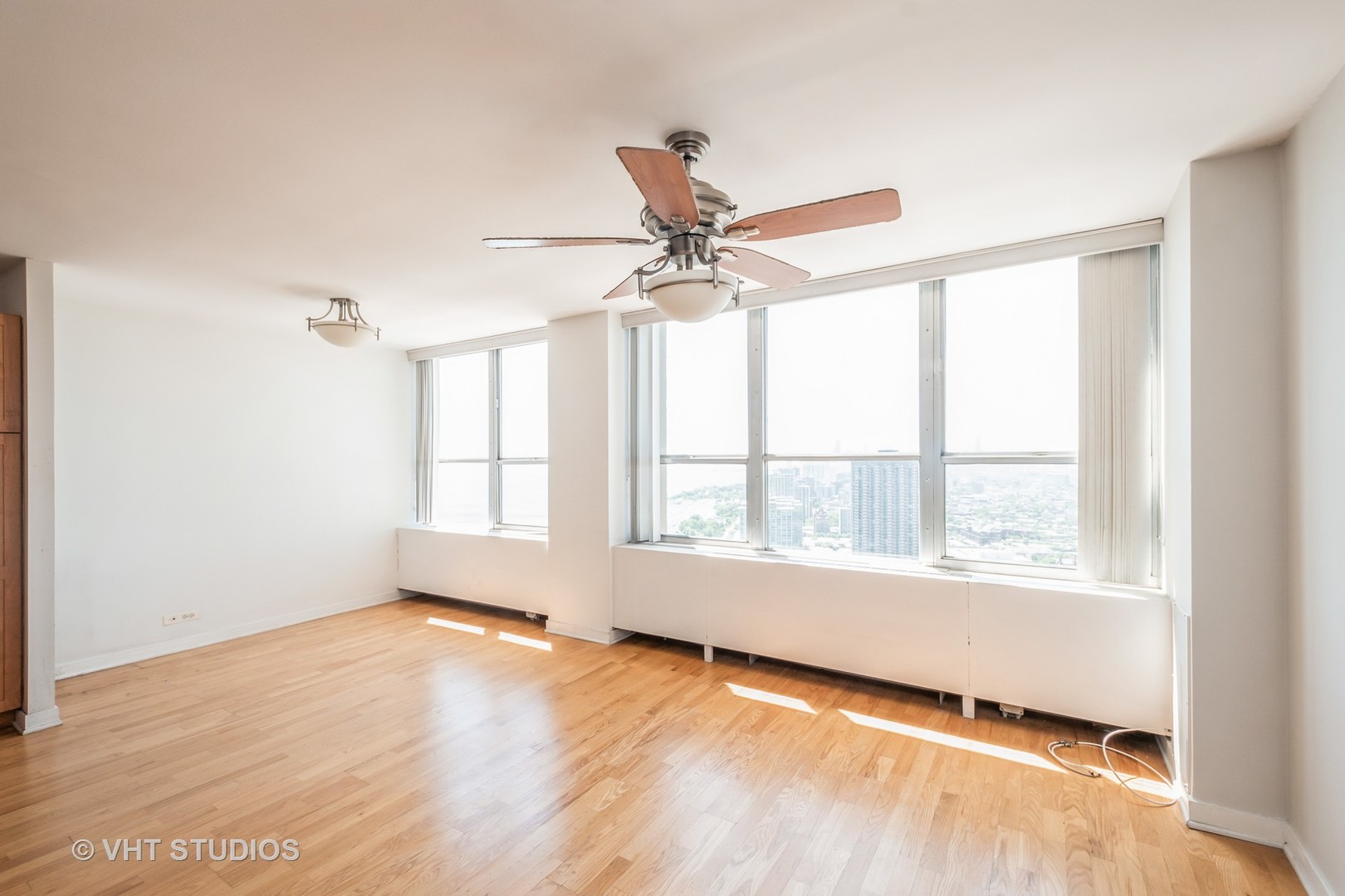 655 West Irving Park Road, Unit 4915 Chicago, IL 60613 - Photo 4 of 17 a view of an empty room with a window