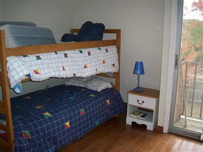 9 Spoondrift Circle Mashpee, MA 02649 - Photo 17 of 21 a bed sitting in a bedroom next to a window