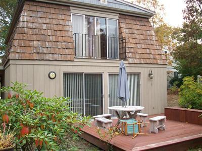 9 Spoondrift Circle Mashpee, MA 02649 - Photo 5 of 21 a view of a two chairs in the patio