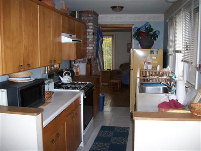 9 Spoondrift Circle Mashpee, MA 02649 - Photo 8 of 21 a kitchen with a stove and a refrigerator